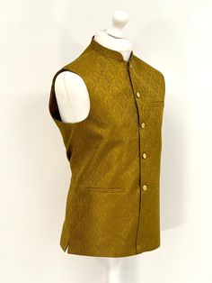 Introducing our exquisite Men's Mendhi Green Jamawar Waistcoat, a luxurious addition to any gentleman's wardrobe. Handcrafted from the finest quality Mendhi Green Jamawar fabric, this waistcoat is fully lined for added comfort. Featuring a timeless design, it comes with silver and black buttons that add a touch of elegance to any outfit. The waistcoat also comes with pockets, providing ample storage space for your essentials. Perfect for formal occasions, this waistcoat is sure to make a stateme Festive Nehru Jacket With Pallu For Semi-formal Occasions, Semi-formal Diwali Nehru Jacket, Semi-formal Nehru Jacket With Zari Work For Festive Occasions, Traditional Nehru Jacket For Diwali Semi-formal, Semi-formal Festive Nehru Jacket With Naqshi, Traditional Nehru Jacket For Diwali Semi-formal Occasion, Traditional Semi-formal Nehru Jacket For Diwali, Festive Semi-formal Nehru Jacket With Naqshi, Fitted Nehru Jacket With Stand Collar For Diwali