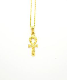 Ankh of Ra Gold Necklace, 14k Gold Vermeil Over Sterling Silver, Ancient Egyptian Ankh Jewelry.The Egyptian ankh necklace carries a powerful message, literally meaning “the breath of life”. This Egyptian revival pendant is considered a key to life, as it offers you a powerful union. Bringing together feminine and masculine aspects that are contained in their form. Creating a never-ending circuit of energy, that helps ensure a boost in energy on a day to day basis.• Material: Our Ankh necklace is Spiritual 14k Gold Ankh Jewelry, 14k Gold Ankh Spiritual Jewelry, Gold Ankh Hallmarked Jewelry, Gold Ankh Necklace Hallmarked, Gold Engraved Ankh Jewelry, Traditional Hallmarked Ankh Necklace, Gold Ankh Amulet Necklace, Spiritual Ankh Necklace In Yellow Gold, Yellow Gold Ankh Necklace Hallmarked