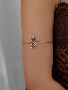 Bohemian Ethnic Upper Arm Bracelet, Spiral Cuff Bracelet, Simple Arm Band, Adjustable Cuff Bracelet, Upper Arm Jewelry Features- Details:Round Color:Antique Silver Gender:Women Type:Arm Cuff Magnetic:No Material:Iron * Ready to ship Price is for one piece of bangle Feel free to contact me with any questions or requests. IMPORTANT NOTE: UK, France, and International customers - please check your custom office for applicable import taxes. We are not responsible for customs duties that you might ha Adjustable Metal Spiral Cuff Bracelet, Adjustable Spiral Metal Bracelet, Trendy Adjustable Spiral Jewelry, Adjustable Spiral Silver Cuff Bracelet, Adjustable Silver Spiral Cuff Bracelet, Upper Arm Cuff Bracelet, Silver Arm Cuff, Upper Arm Cuff, Arm Cuff Bracelet