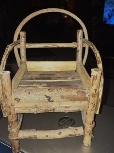 an old wooden chair sitting on top of a table