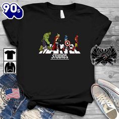 Avengers Marvel Studios Abbey Road Shirt   Your everyday style essential. Made with soft, breathable fabrics for comfort all day long. Choose from a variety of designs and colors to showcase your personal style. Perfect for casual outings or layering with other pieces. Versatile, timeless, and a must-have in any wardrobe.Avengers Marvel Studios Abbey Road Shirt – Our Custom T-shirts are what you are looking for. Made with highly breathable and soft fabric, our  T-shirts are made t Marvel Gifts, Abbey Road, Royal Red, Marvel Studios, Custom T Shirts, Fashion Essentials, Active Lifestyle, Unisex Style, Everyday Style