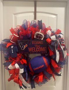 a football wreath is hanging on the front door