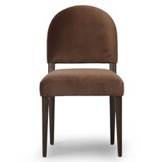 an upholstered chair in brown velvet