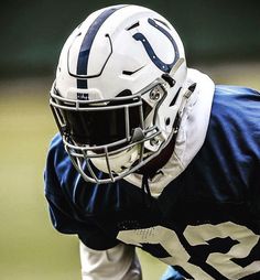 a close up of a football player wearing a helmet