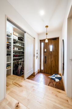 an open closet with shoes and other items in it