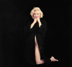 marilyn monroe posing for the camera with her legs spread out in front of her face