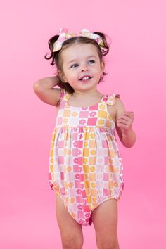 Live your best summer life in our Sunset Checkers Dream Bubble Romper! Made from breathable bamboo material, this sleeveless romper features vibrant colors inspired by a summer sunset. Don't just dream about looking stylish and feeling comfortable - make it a reality with this playful piece! Made from theÂ softest and most breathableÂ bamboo viscose material,Â your babe won't want to take this off! Designed for all the loveÂ and extra snuggles! SleepÂ and play with zero irritation with our tag-l Tuxedo Accessories, Toddler Flower Girls, Girls Gloves, Girls Dress Outfits, Toddler Flower Girl Dresses, Infant Flower Girl Dress, Bamboo Material, Summer Life