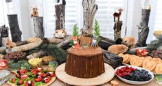 a table topped with lots of different types of foods and desserts on top of it