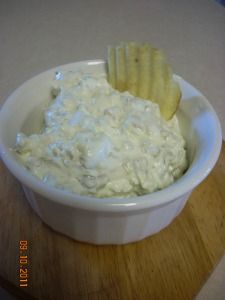 a white bowl filled with cheese and crackers