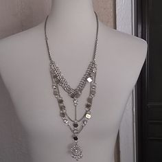 Silver And Gold With Crystals, About 32". New Without Tags Silver Metal Rhinestone Necklace With Chain, Silver Rhinestone Chain Necklace, Silver Layered Necklace With Adjustable Chain For Party, Silver Metal Layered Necklace, Silver Metal Layered Necklace With Adjustable Chain, Silver Layered Necklace With Adjustable Chain, Silver Long Necklace With Adjustable Chain For Party, Silver Long Rhinestone Necklace, Silver Long Costume Jewelry Necklace