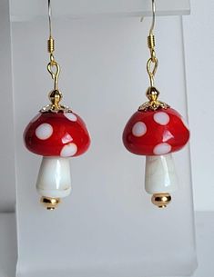 These earrings feature bright red and white glass Mushroom beads. The remaining beads and findings are Gold-plated. The ear wires are fish hooks.  Custom Orders are always welcome! Mushroom Beads, Glass Mushrooms, Fish Hooks, Providence Ri, Gold Plated Earrings, Bright Red, White Glass, Ear Wires, Custom Orders