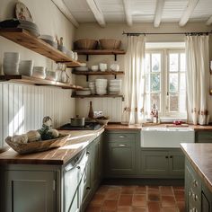 the kitchen is clean and ready to be used for cooking or baking, as well as dishes