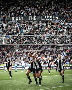 there are two women playing soccer on the field and in front of a large crowd