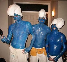 three men with blue paint on their bodies