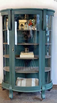 a glass display cabinet with shelves in it