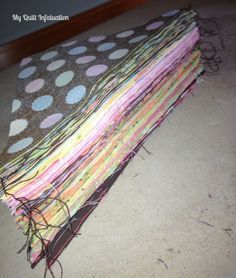 several pieces of fabric are stacked on top of each other