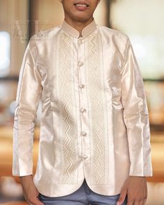 Experience the ultimate in comfort and style with our exquisite Gazar fabric coat barong, expertly crafted with layers of luxurious fabric to provide a thick and high-quality finish.  Details: Fabric: Metallic Gazar with lining and shoulder pads Color: Shade of Beige Collar: Chinese Collar  Design: Zigzag  Shipping:  We ship all our items directly from the Philippines using DHL to ensure fast and reliable shipping worldwide. To complete your shipping details, we kindly request that you provide u Elegant Beige Nehru Jacket With Long Sleeves, Long Sleeve Formal Outerwear For Festive Occasions, Formal Long Sleeve Festive Outerwear, Cream Fitted Long Sleeve Nehru Jacket, Ceremonial Long Sleeve Cream Kurta, Ceremonial Cream Long Sleeve Kurta, Beige Long Sleeve Nehru Jacket For Formal Occasions, Fitted Beige Outerwear For Festive Season, Festive Fitted Beige Outerwear