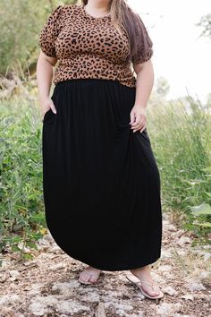 Effortlessly elegant and versatile, the Jocelyn Maxi Skirt is a must-have for any wardrobe. Crafted from a lightweight fabric, its maxi length and split sides provide a flowy and flattering fit. The elastic waist ensures comfort all day long. Embrace your inner goddess with this stunning skirt! The split sides measure 19"-20" from the top of the waistband. Fits true to size. Model is wearing a 1X and is 5'7". Size Chart Length Waist 1x 40" 38" 2x 40" 40" 3x 40" 44" *Measurements are approximate Black Full-length Lined Maxi Skirt, Versatile Flowy Maxi Skirt For Day Out, Versatile Flowy Long Maxi Skirt, Flowy Versatile Maxi Skirt, Casual Flowy Full-length Maxi Dress, Flowy Maxi Skirt With Long Inseam For Spring, Black Relaxed Fit Midi Maxi Skirt, Stretch Maxi Skirt For Day Out, Versatile Flowy Maxi Skirt