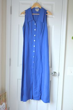 Vintage Royal Blue Dress Collared button down Beautiful fit Rayon and Linen blend Size: 12 Brand: SL Fashions Measurements: 18" pit to pit 53" long 16" waist All vintage items have some wear to them but any noticeable flaws will be noted. Vintage Blue Cotton Maxi Dress, Classic Blue Button-up Dresses, Blue Relaxed Fit Button-up Dress, Blue Button-up Maxi Dress With Button Closure, Vintage Blue Button-up Dress, Royal Blue Dress, Collar Dress, Linen Blend, Dress Clothes For Women