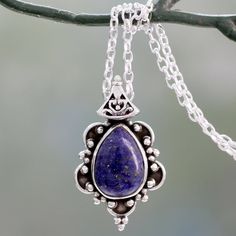 A smooth tear-shaped cabochon of deep blue lapis lazuli is the center of attention in this elegant pendant necklace from India's Neeru Goel. The gem is set in sterling silver, ornately embellished with tiny silver balls that contrast with the darkly oxidized background. A fancy bale suspends the pendant on a classic sterling silver cable chain with a spring-ring clasp. Blue Cabochon Drop Jewelry, Blue Drop Cabochon Jewelry, Blue Drop Jewelry With Cabochon, Elegant Lapis Lazuli Oval Pendant Jewelry, Elegant Oval Cabochon Lapis Lazuli Jewelry, Elegant Lapis Lazuli Oval Cabochon Jewelry, Blue Lapis Lazuli Teardrop Necklace, Silver Lapis Lazuli Round Pendant Necklace, Silver Necklace With Round Lapis Lazuli Pendant