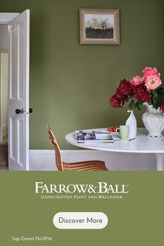 a dining room table with flowers on it and the words farrow & ball above it