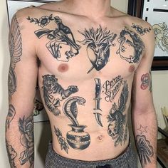 a man with many tattoos on his chest