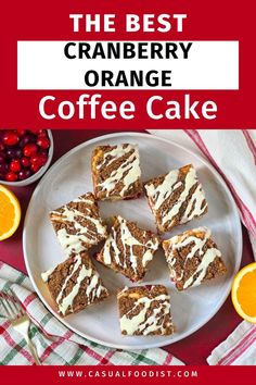 the best cranberry orange coffee cake on a white plate with sliced oranges