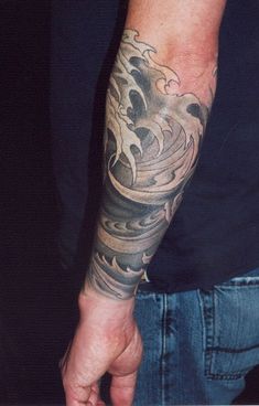 a man with a tattoo on his arm