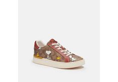 Coach X Peanuts Clip Low Top Sneaker in Signature Canvas with Snoopy Woodstock Print Size:11 Color: Khaki/ Terracotta Signature coated canvas and leather upper Fabric lining and footbed Rubber outsole Lace-up closure This special Coach x Peanuts collaboration combines our legacy of leathercraft  with the playful attitude of the Peanuts crew  2022 PEANUTS WORLDWIDE Style No. CE860 Casual Coach Sneakers With Contrast Sole, Snoopy Woodstock, The Peanuts, Our Legacy, Signature Canvas, Snoopy And Woodstock, Woodstock, Golden Goose Sneaker, Leather Craft