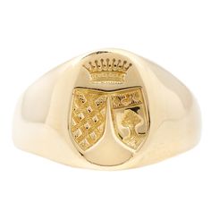 18k yellow gold vintage signet with an engraving of two crests under a crown. Setting measures 12mm at tallest point. Band width is 6mm tapering to 2mm at back. Size 6.25 in stock Please allow 1-2 weeks for resizing All resized rings are final sale Please make sure to have your correct ring size before ordering