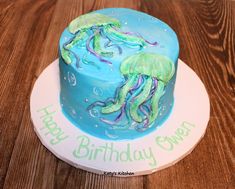 a birthday cake decorated with an octopus and jellyfish