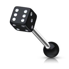 a black and white dice on top of a metal ball