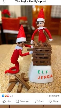 two elfs are playing with each other on the table