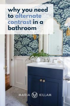 a bathroom with blue and white wallpaper and a vanity in the corner, which has a mirror above it that says why you need to alterinate contrast in a bathroom