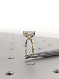 an engagement ring sitting on top of a table