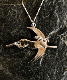 Hare and moon pendant necklace in pewter by Paul Szeiler. Available with 16 , 18 , 20 or 22 , inch sterling silver chain. Handmade in the Highlands of Scotland. The Hare and moon pendant is 6 cm wide. Once purchased your Hare pendant will be securely packaged and posted to you within 3 working days. Silver Necklaces With Moon Charm, Pewter Jewelry, Pewter Pendant, Moon Pendant Necklace, Funky Jewelry, Statement Pendant, Moon Pendant, Moon Necklace, Sterling Silver Chains