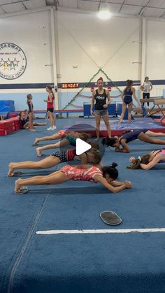 several girls are doing exercises on the floor