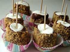 chocolate covered desserts with marshmallow toppings and toothpicks