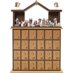 a wooden cabinet filled with lots of little figurines on top of it's sides