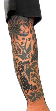 a man's arm with tattoos on it