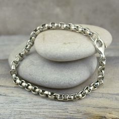 Classic, simple, and always a perfect look for men or women!The Box Bracelet comes to you in handcrafted sterling silver in 7.5 inches.  If a longer length is required, you can select 8.0 or 8.5 inches for an additional fee.Appropriate for men and women offered in a unisex style, that's a timeless look and always perfect!Metal:  .925 Sterling SilverFinish:  High PolishClosure: LobsterMSRP:  $119.99Part of the appeal of handcrafted sterling silver jewelry includes slight variations and irregulari Unique Sterling Silver Jewelry, Silver Link Bracelet, Large Bracelet, Christian Jewelry, Anklet Jewelry, Design Silver, Unisex Style, Chain Earrings, Ankle Bracelets