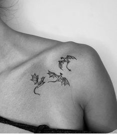 a black and white photo of a woman's chest with leaves on it,