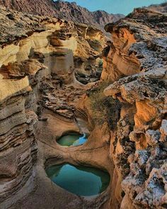 some very pretty rocks and water in the middle of it's own canyons