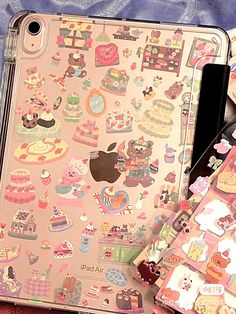 an ipad case with many stickers on it