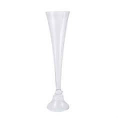 a tall white vase sitting on top of a table