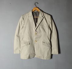 Used jacket, Show sign of wear, Soft spot of yellowish stains at back, Overall still in good vintage condition (Please see picture) Size on tag: Large (Japan sizing) with actual measurement taken when lying flat armpit 20.5 inches and 28 5 inches in total lenght (Approx) Shoulder to shoulder measurement: 17.5 Inches Sleeve lenght from shoulder stitching to cuff: 24 Inches Please note that vintage sizing is not the same as modern sizing.  Always go by the measurements we provide and compare them to an item that fits you well. Feel free to message me for measurements if you are not sure it will fit. Tag Label: R.NEWBOLD Material: Cotton blends Feel free to e-mail me about any questions you have!  Please review our shop policies before make an order. Ships out within 1-3 business days Thank Y Single Breasted Cotton Blazer For Streetwear, Single-breasted Cotton Blazer For Streetwear, Vintage Beige Cotton Blazer, Streetwear High Fashion, Casual Workwear, Soft Spot, Workwear Jacket, Japanese Streetwear, Cotton Blazer