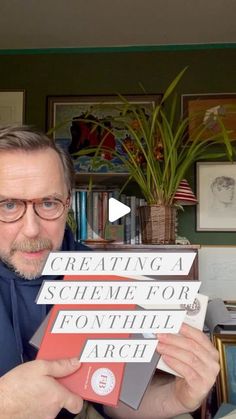 a man holding up three books in front of him with the title creating a scheme for fonthill arch