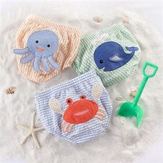 three baby bibs with sea animals on them