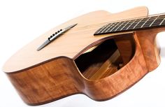 an acoustic guitar with a wooden case