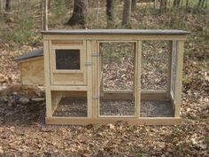 a small chicken coop in the woods